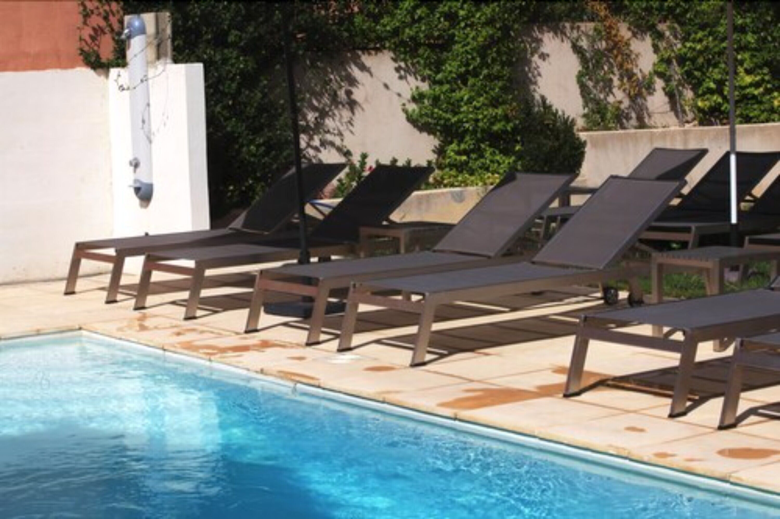 seasonal outdoor pool, open 10:00 am to 10:00 pm, pool umbrellas