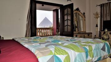 Queen Double Room (Private Bathroom) | Minibar, desk, iron/ironing board, rollaway beds