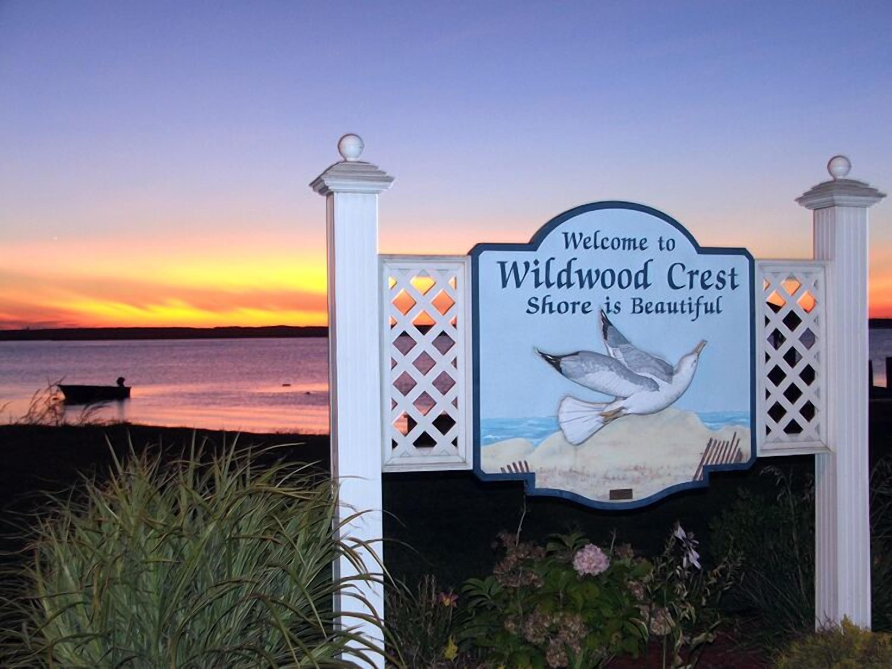 A sign welcoming visitors to Wildwood Crest with a seagull illustration.