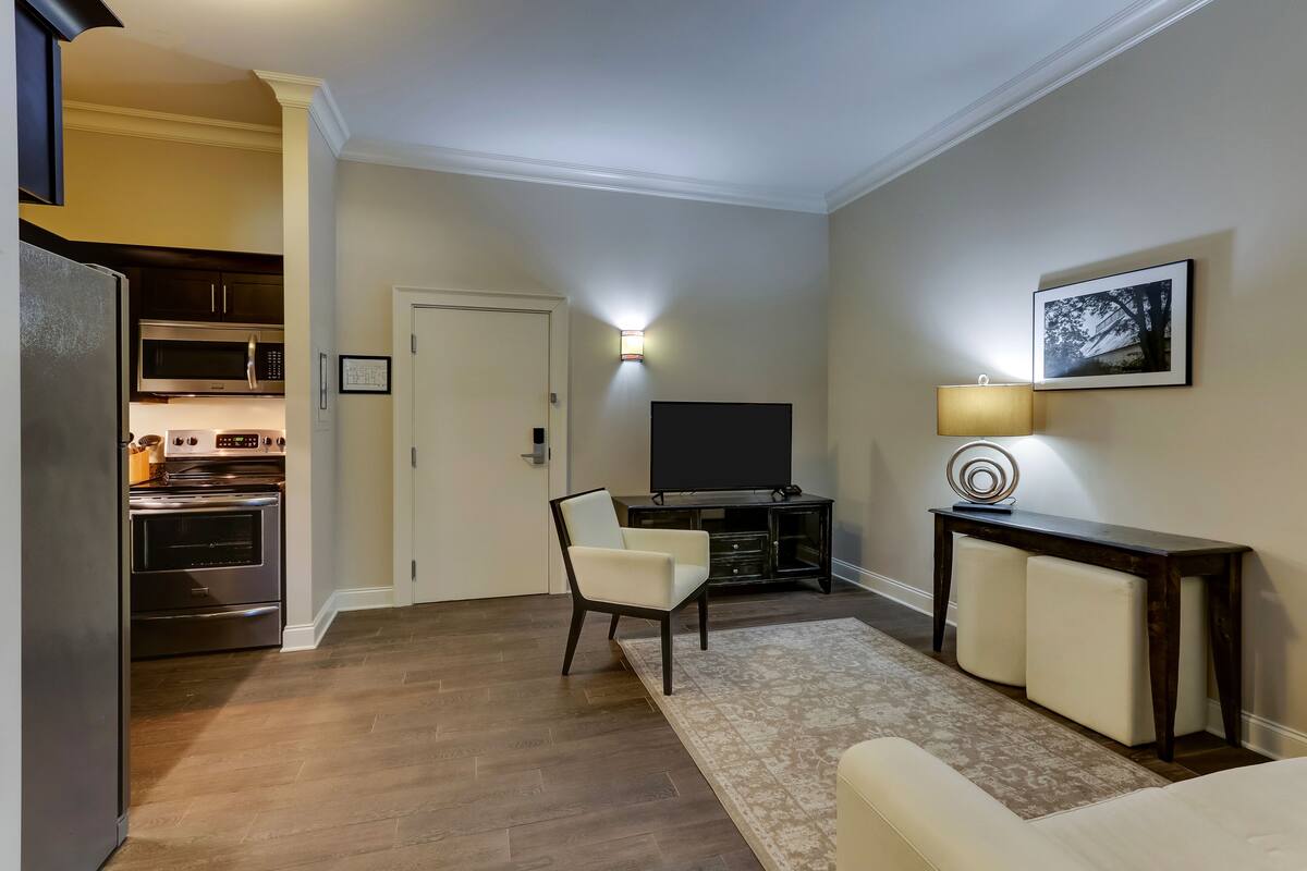 double queen suite | living area | flat-screen tv