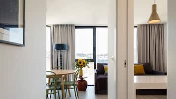 Duplex, 2 Bedrooms | Living room | 43-inch Smart TV with cable channels