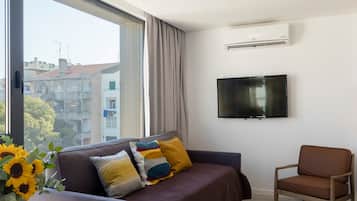 Duplex, 2 Bedrooms | Living room | 43-inch Smart TV with cable channels