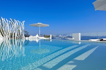 Master Suite with Infinity Pool | Outdoor pool | Seasonal outdoor pool, an infinity pool, pool umbrellas, sun loungers