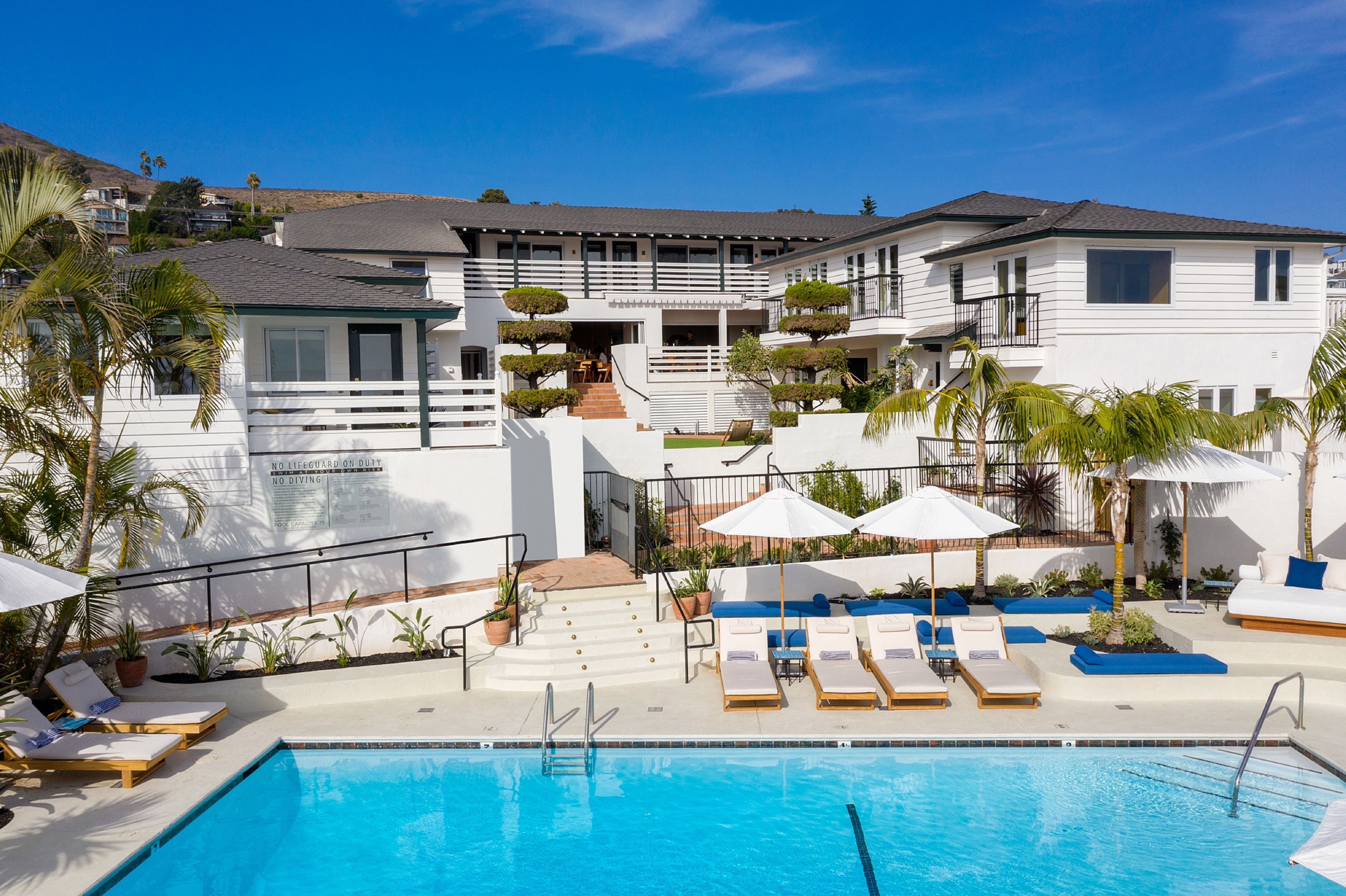 Outdoor pool, open 8 AM to 9 PM, pool umbrellas, sun loungers