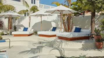 Outdoor pool, open 8 AM to 9 PM, pool umbrellas, pool loungers