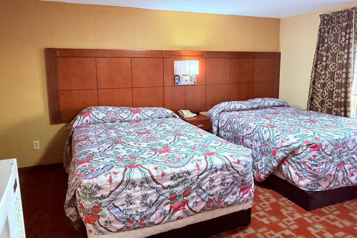 Economy Room, 2 Queen Beds, Smoking | Desk, iron/ironing board, free rollaway beds, free WiFi