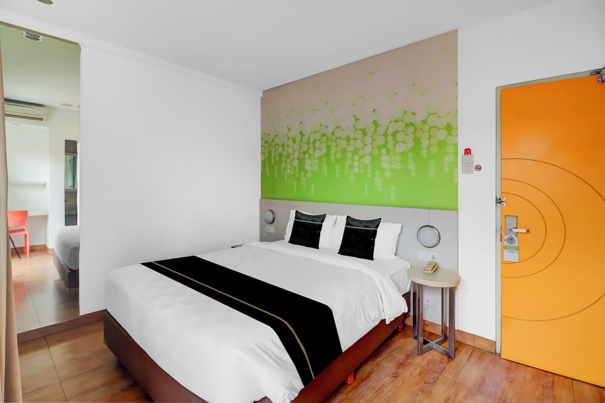 Deluxe suite | Een minibar, een kluis op de kamer, een bureau, gratis wifi