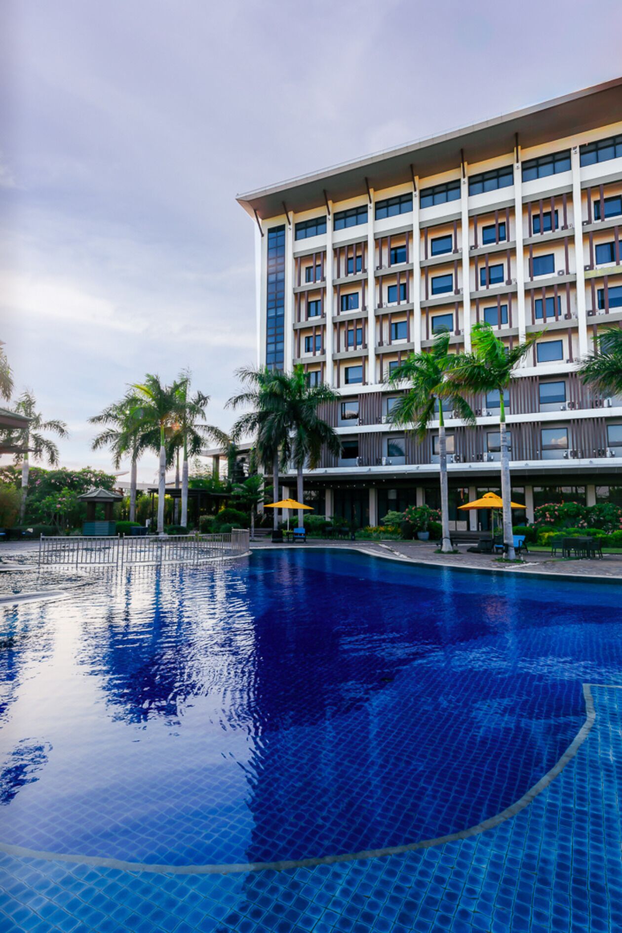 outdoor pool, pool umbrellas, lifeguards on site