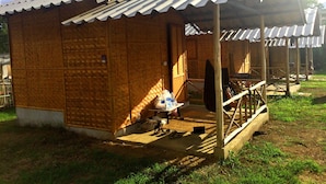 A small, single-story building with a corrugated metal roof and a wooden porch. - Sleepy Hut Pai (Pai)