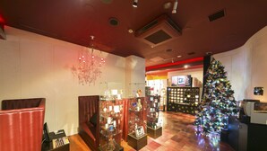 A hotel lobby with a Christmas tree, seating areas, and a display of items. - Sendai Hotel Renaissance (Sendai)