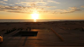 On the beach, sun-loungers, beach umbrellas, beach towels
