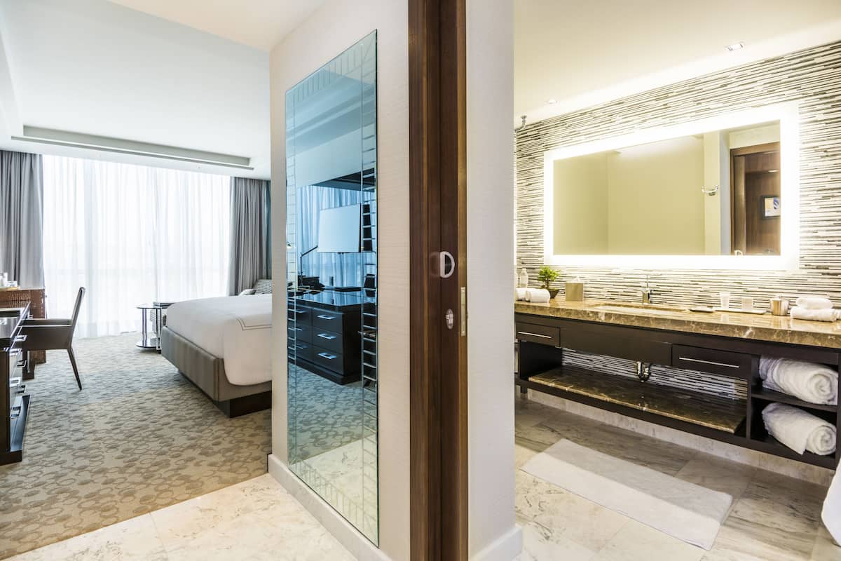 rainfall showerhead, hair dryer, towels