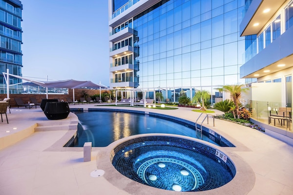 Outdoor pool, pool umbrellas, sun loungers