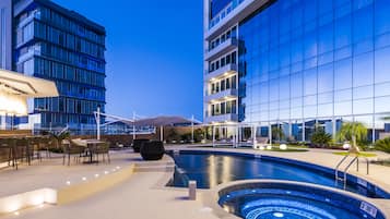 Outdoor pool, pool umbrellas, sun loungers