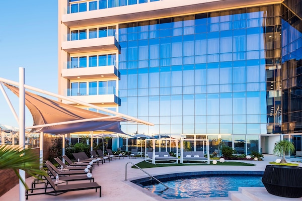 Outdoor pool, pool umbrellas, sun loungers
