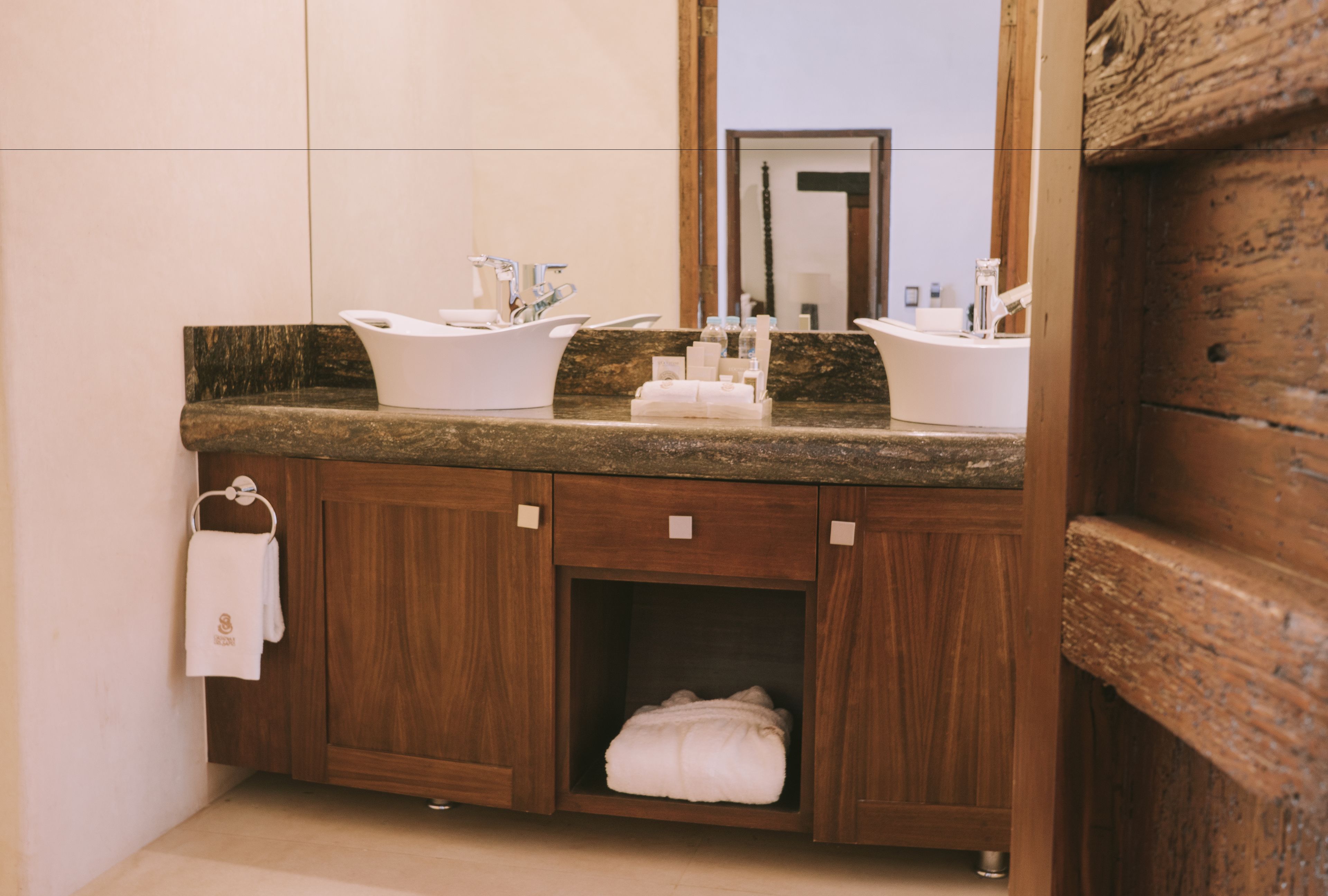 designer toiletries, hair dryer, bathrobes, slippers