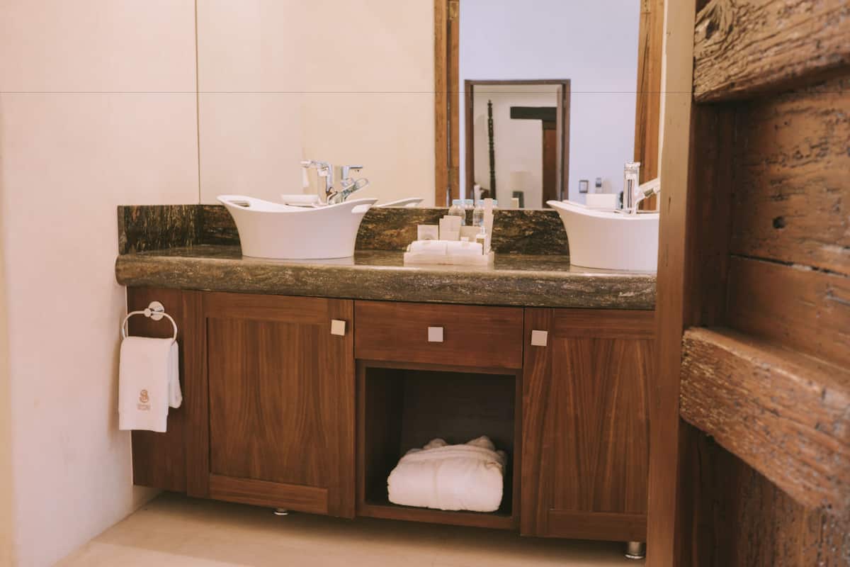 designer toiletries, hair dryer, bathrobes, slippers