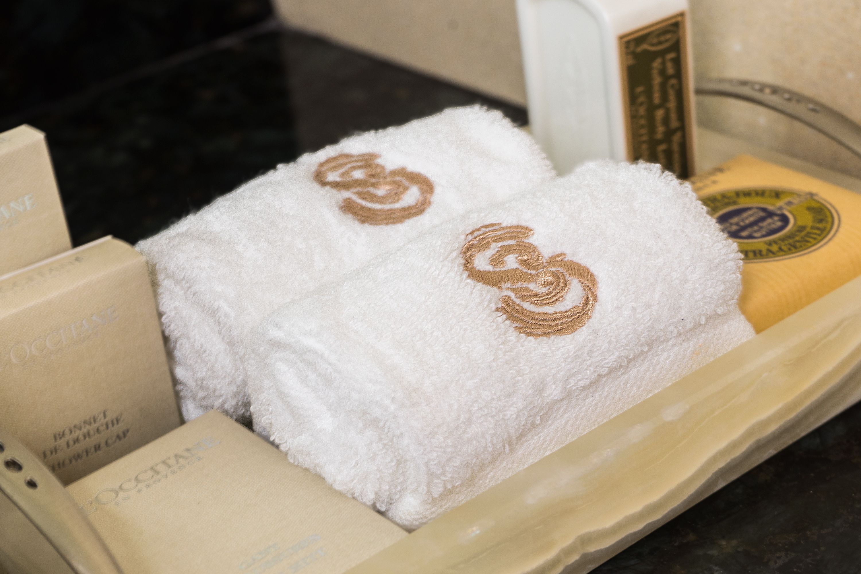 designer toiletries, hair dryer, bathrobes, slippers