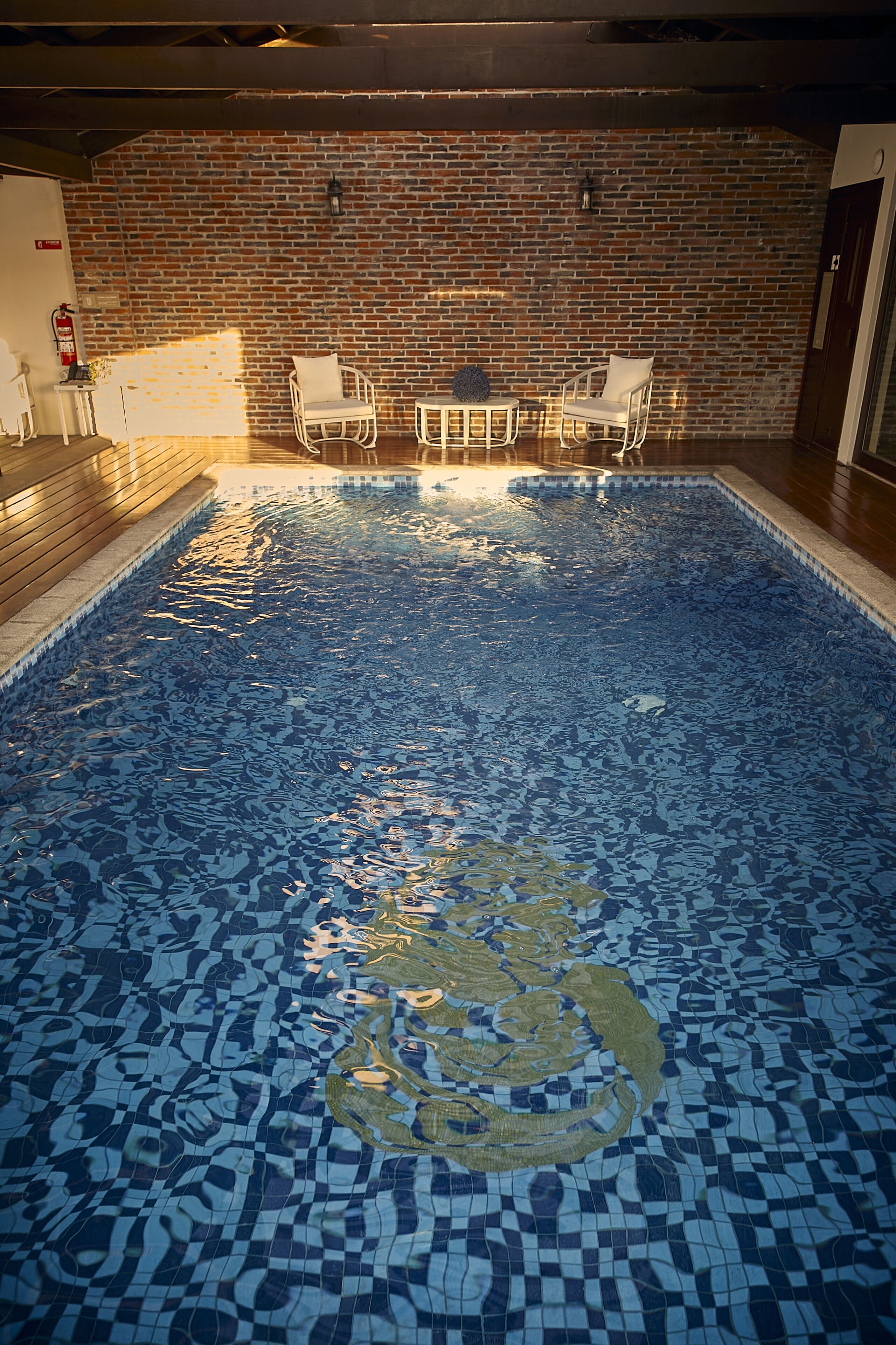 indoor pool, pool umbrellas, pool loungers