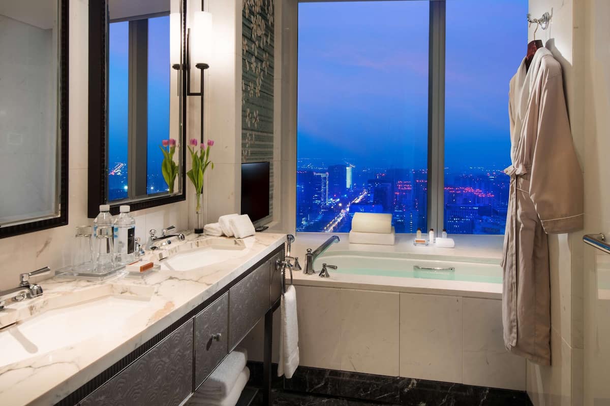 rainfall showerhead, designer toiletries, hair dryer, bathrobes