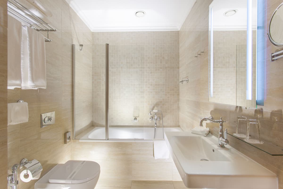 designer toiletries, bathrobes, slippers, towels