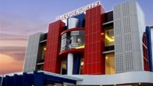 A building with a prominent sign reading 'HALOGEN BEE'. - Halogen Hotel (Sidoarjo)