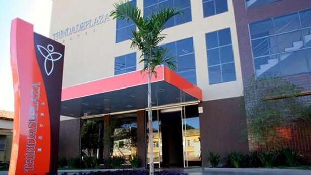 A modern building with a sign reading "TRINDADEPLAZA HOTEL." - Trindade Plaza Hotel (Trindade)