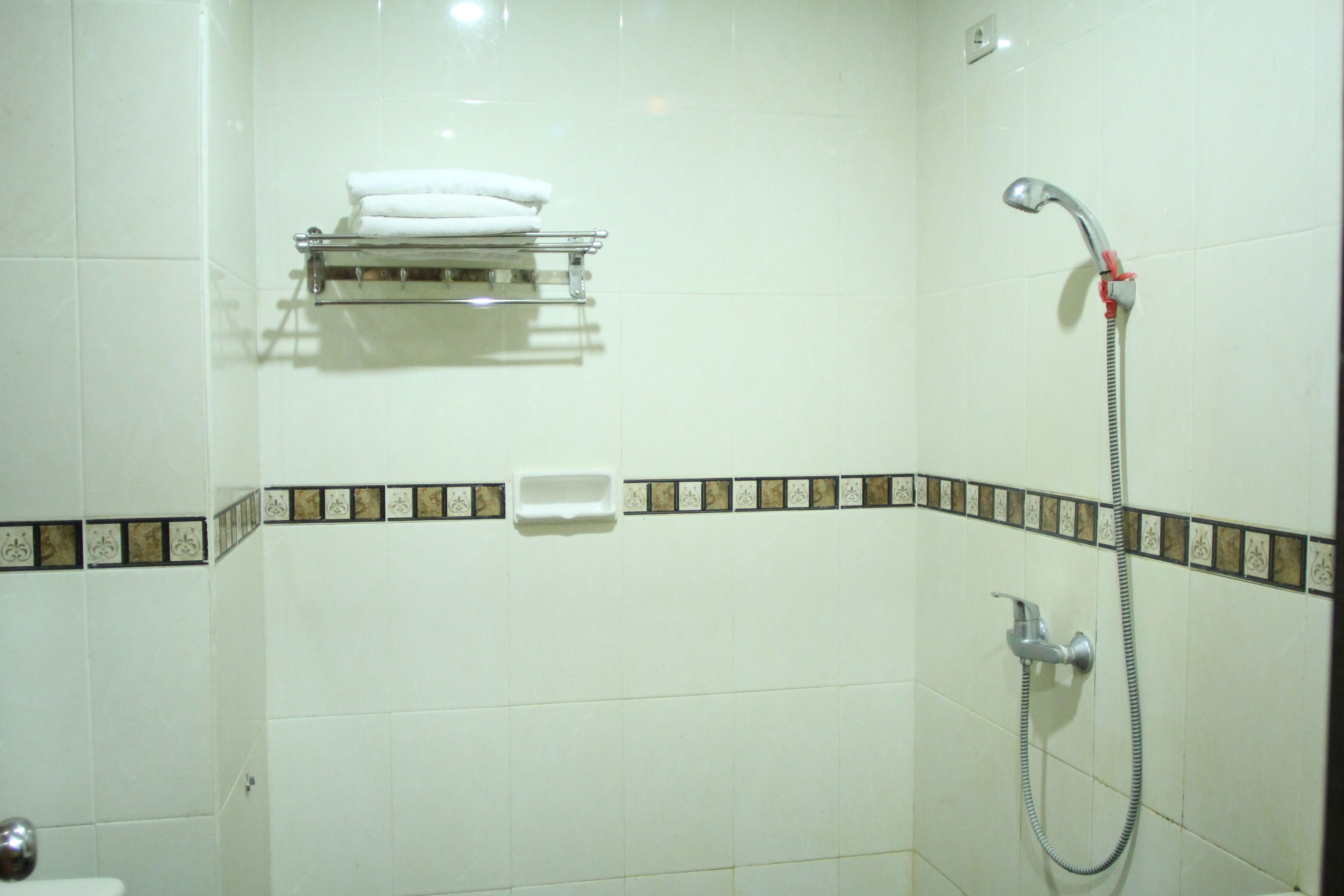 shower, free toiletries, slippers, towels