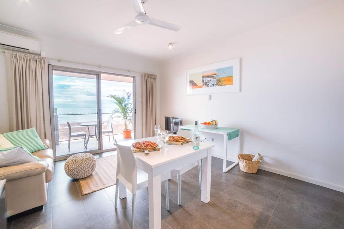 Executive Suite, Kitchen, Ocean View | Living area | Flat-screen TV, DVD player