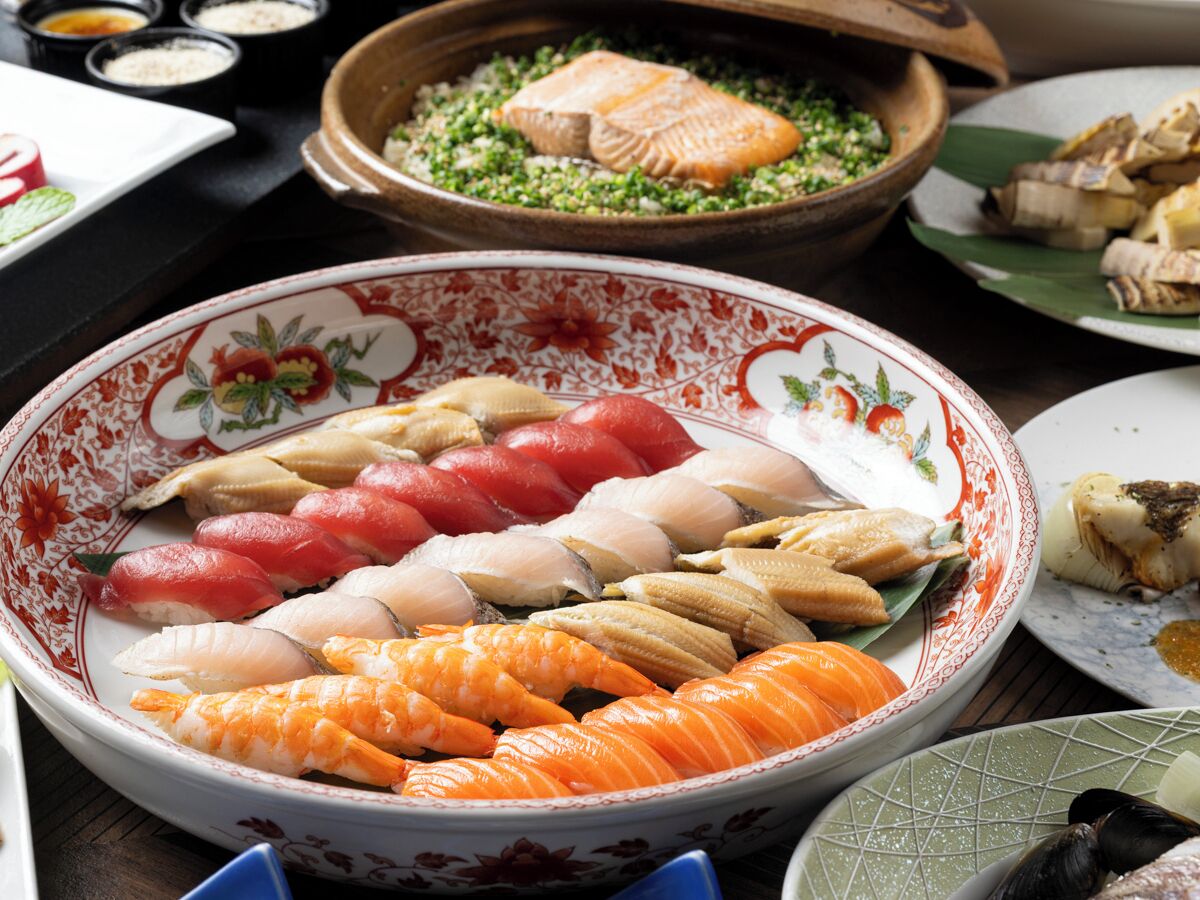 A variety of seafood arranged on a decorative plate.