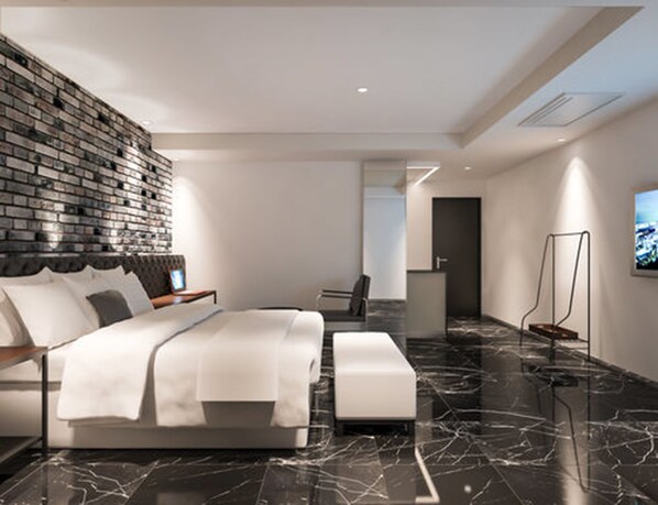 Doppia Deluxe | Copriletto in piuma, minibar con snack e bevande gratuite, una scrivania