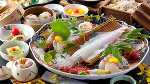 A variety of traditional dishes and food items displayed on a table.