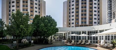 Outdoor pool, pool umbrellas, sun loungers
