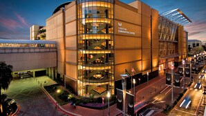 A modern building with a glass facade, labeled "Sandton Convention Centre," featuring a central staircase and multiple levels. - Garden Court Sandton City (Sandton)