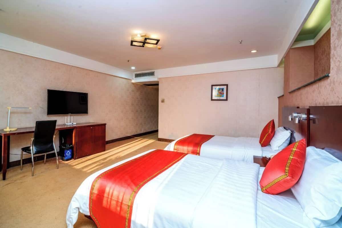 Habitación Deluxe, 2 camas individuales | Área de sala de estar