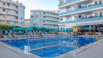 Outdoor pool, pool umbrellas, sun loungers