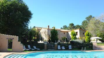 Outdoor pool, open 9:00 AM to 8:00 PM, pool umbrellas, pool loungers