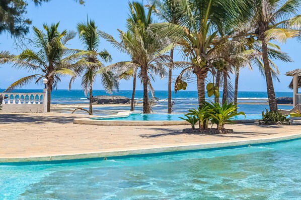 2 outdoor pools, pool umbrellas, pool loungers