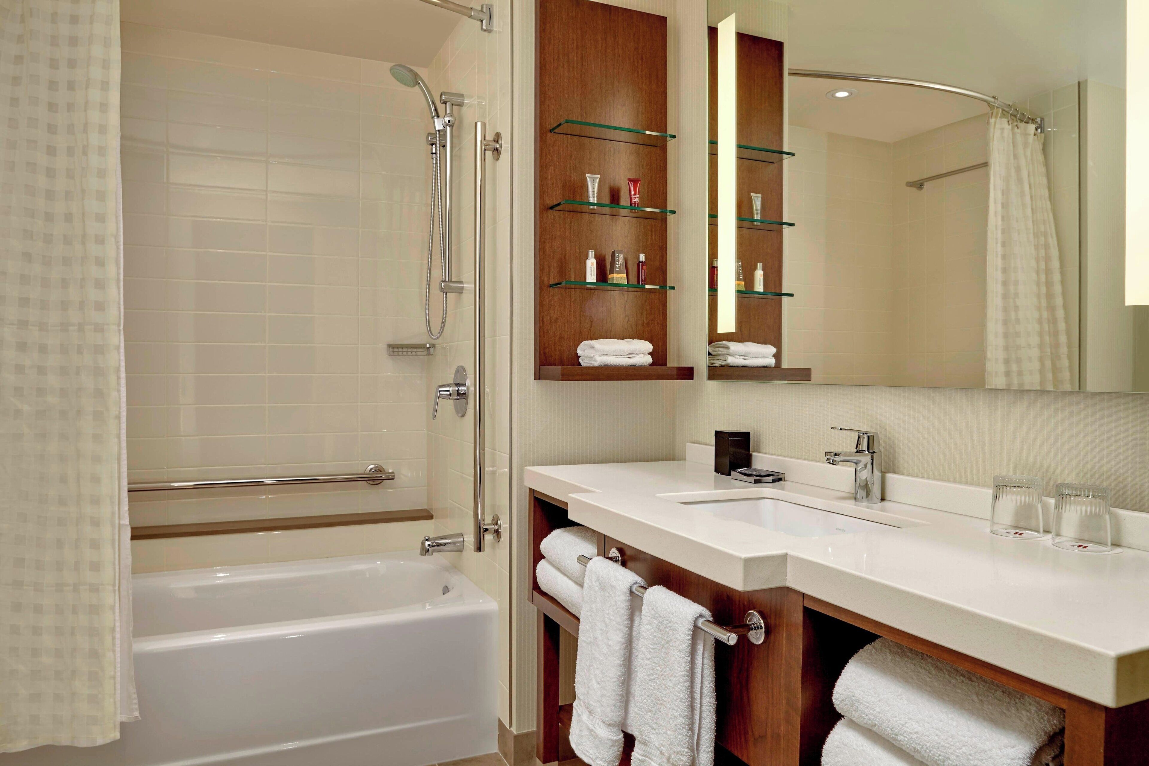 designer toiletries, hair dryer, towels