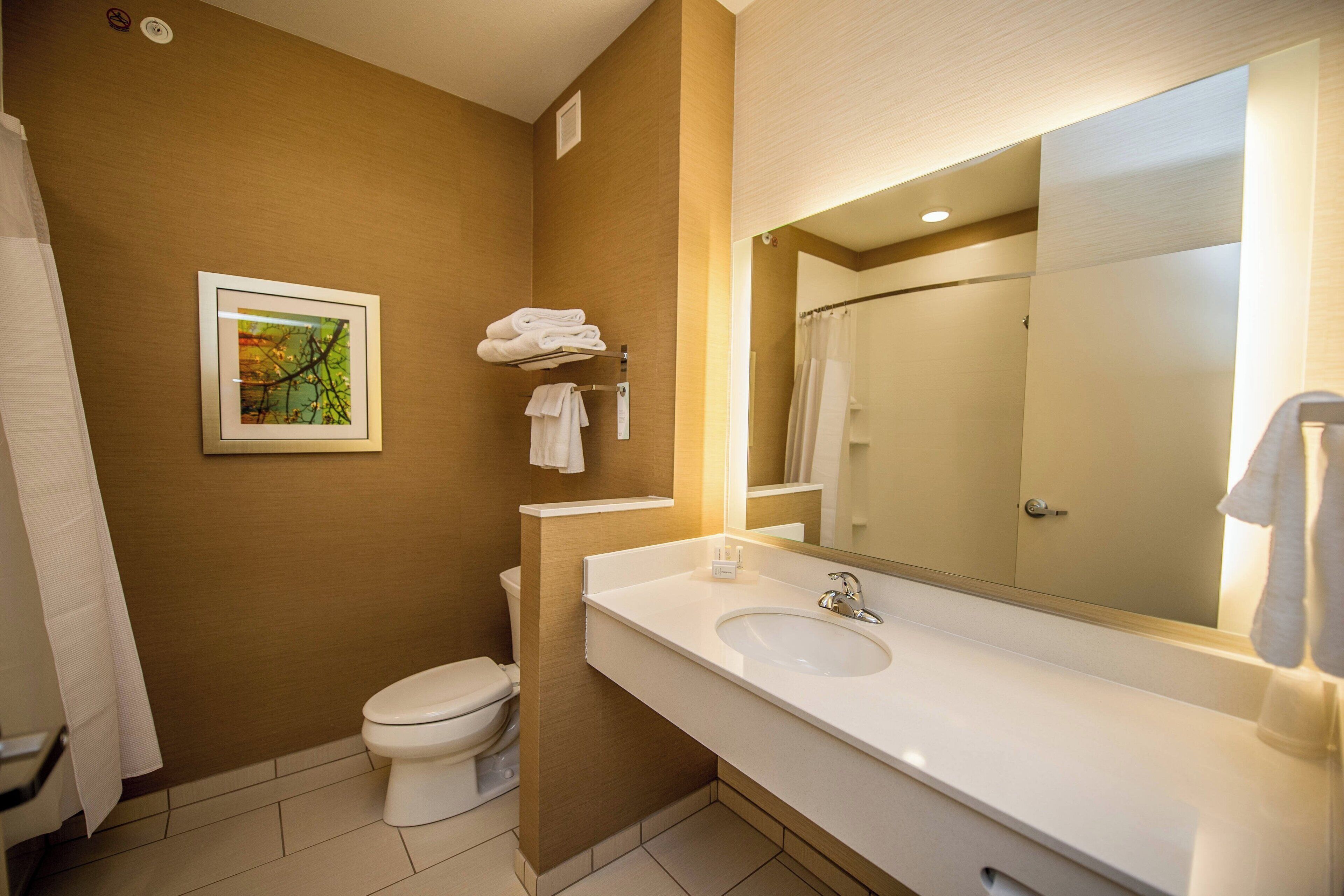 room, 1 king bed | bathroom | shower, free toiletries, hair dryer, towels