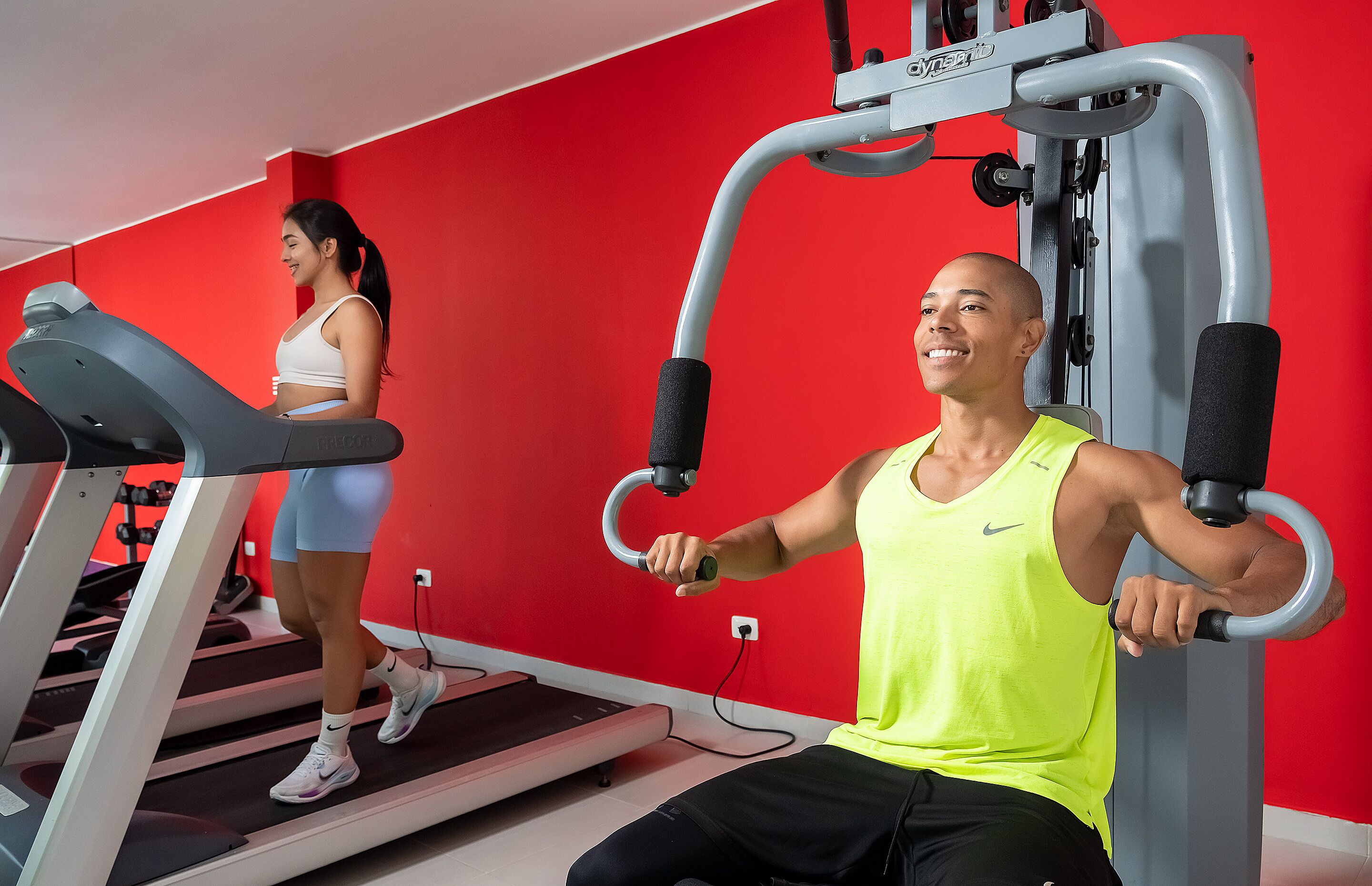 A gym with exercise equipment and treadmills.