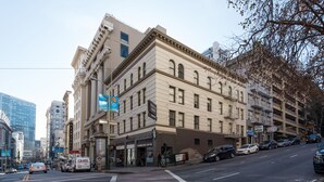 A multi-story building with a ground-floor Starbucks coffee shop. - The Urban San Francisco (San Francisco)