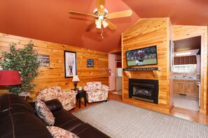 Cabin, 1 Bedroom, Bathtub (Pine Needles Cabin (#6)) | Living area | Fireplace, DVD player - Pine Needles 6 1 Br cabin by RedAwning (Pigeon Forge)