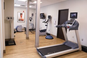 A fitness center with treadmills, stationary bikes, and a rowing machine. - Holiday Inn Jonesboro by IHG (Jonesboro)