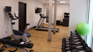 A fitness center with treadmills, stationary bikes, and free weights. - Holiday Inn Jonesboro by IHG (Jonesboro)