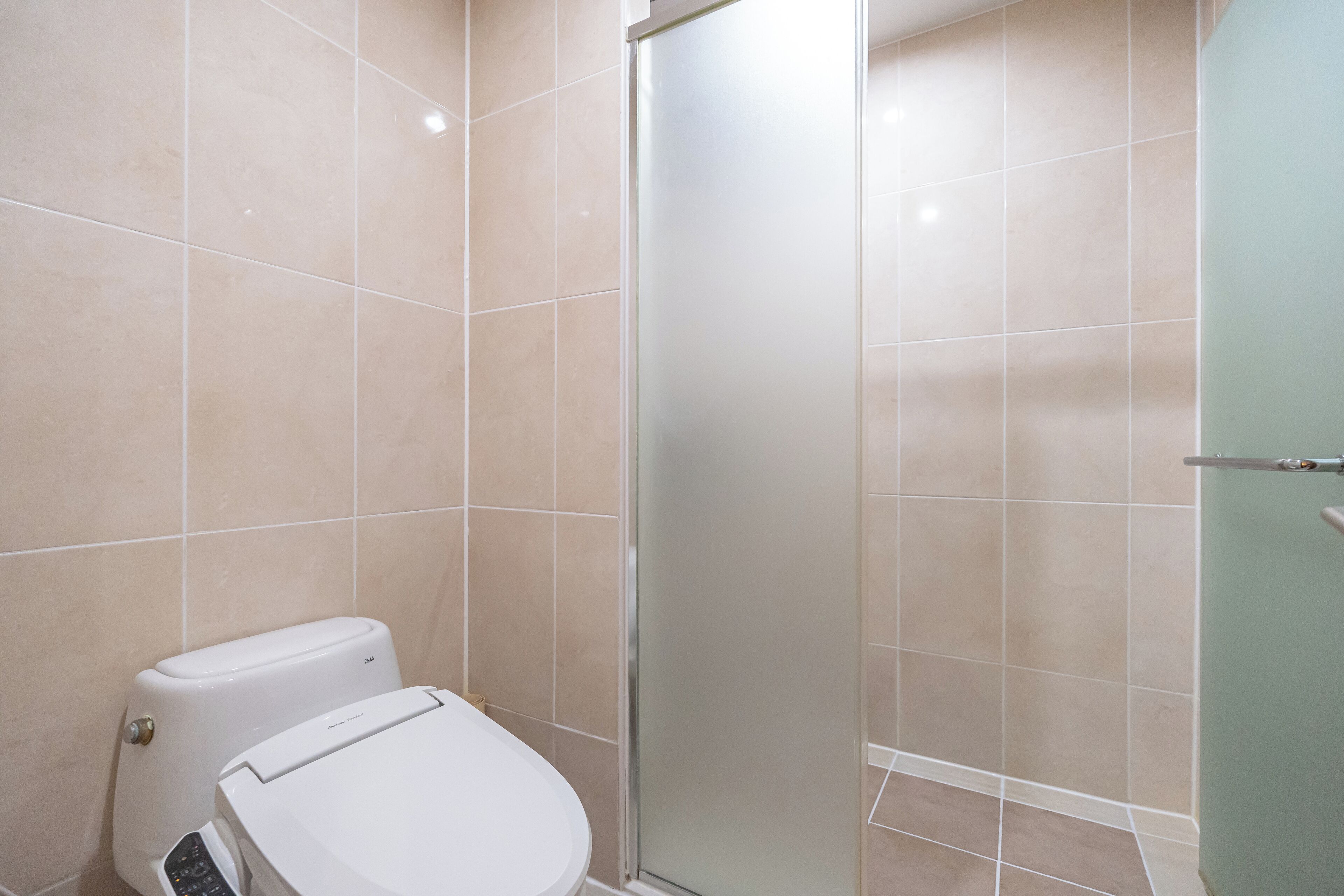 deluxe room (cooking not allowed) | bathroom | shower, hair dryer, slippers, towels