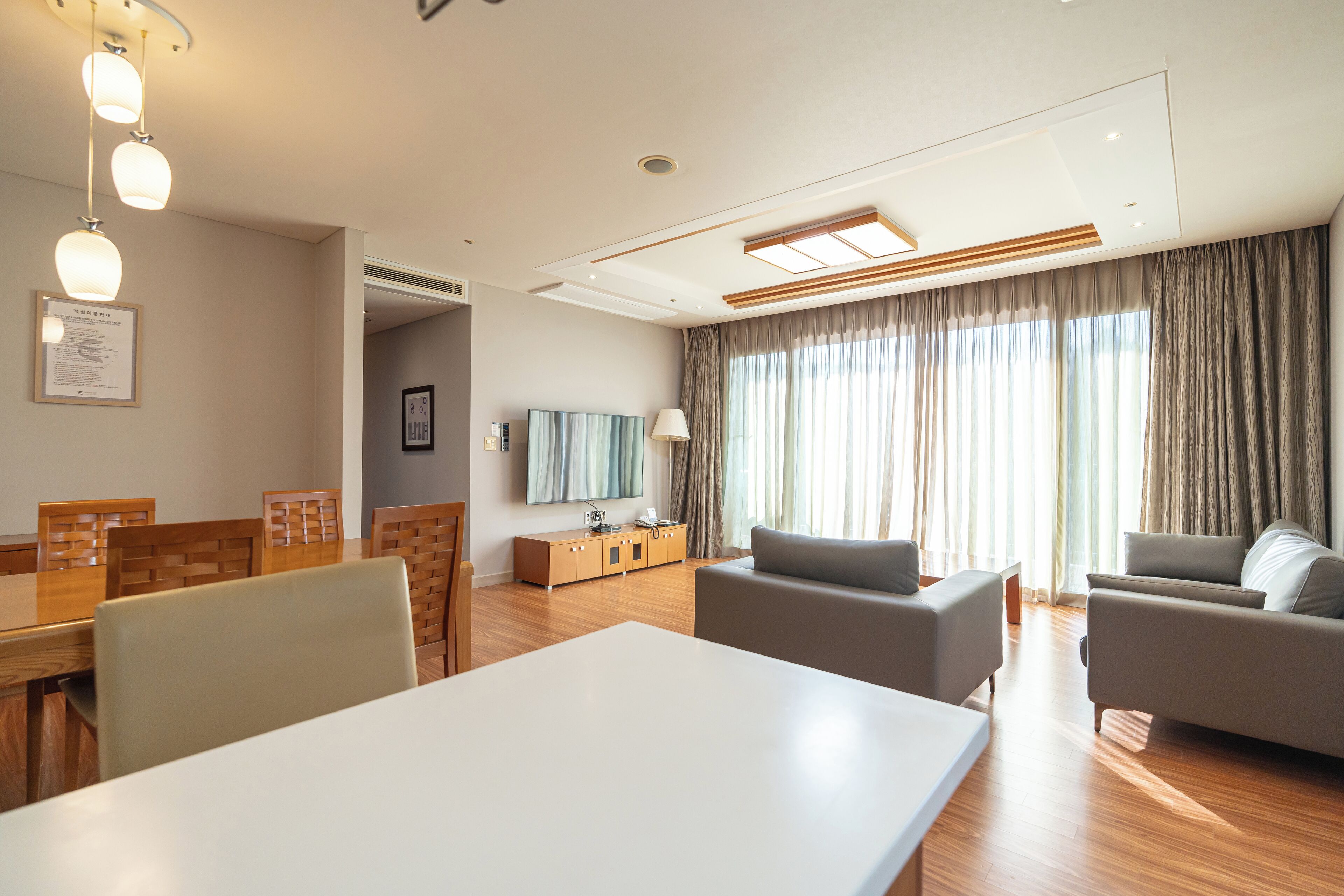 deluxe room (cooking not allowed) | living area | 30-inch flat-screen tv with cable channels, tv