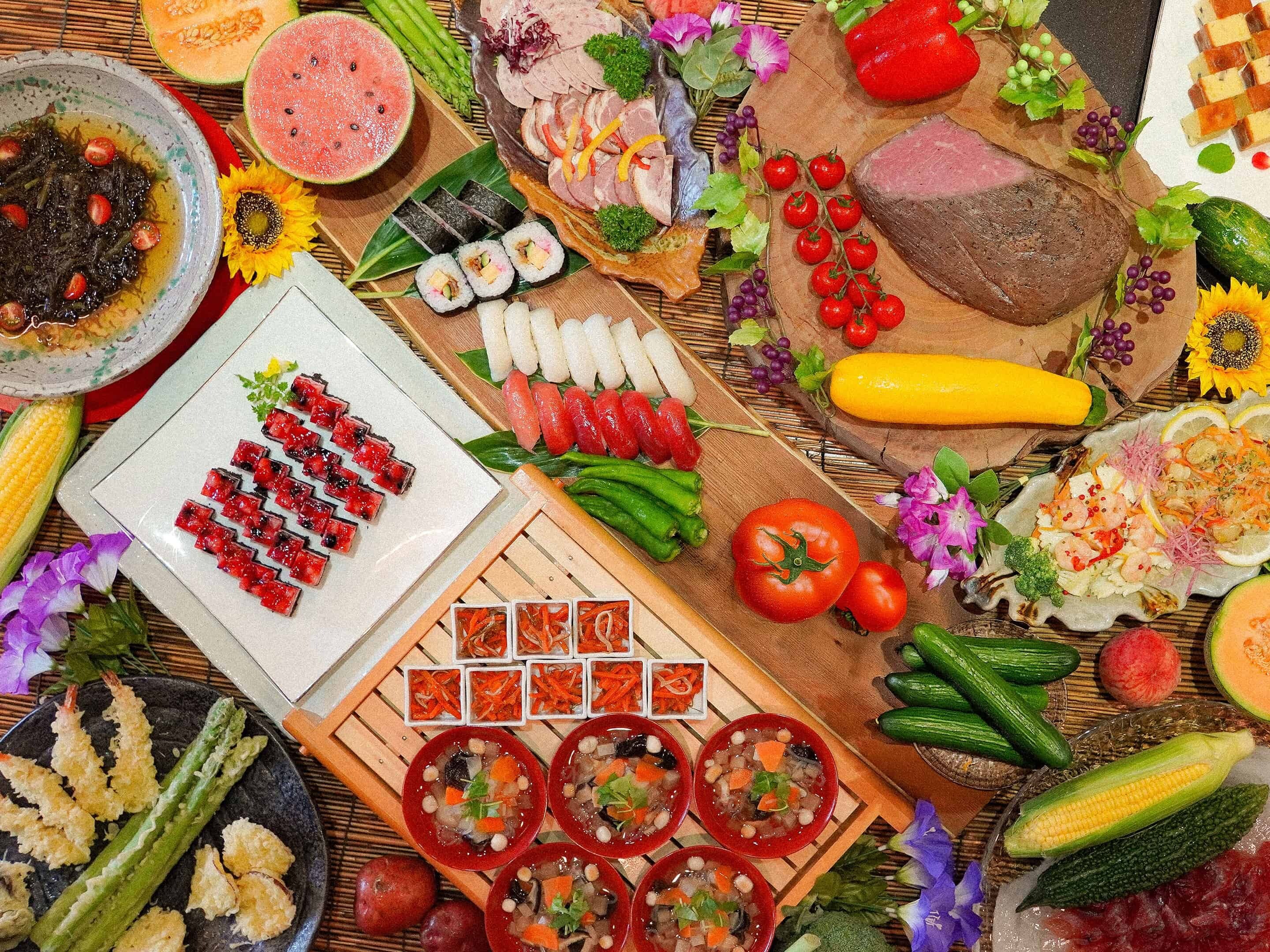 A variety of food items and vegetables arranged on a table.