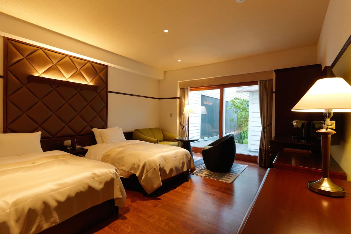 executive twin room with private hot spring, non smoking | in-room safe, desk, free wifi, bed sheets