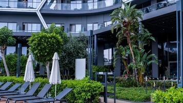 Indoor pool, 2 outdoor pools, open 7:30 AM to 7:00 PM, pool umbrellas